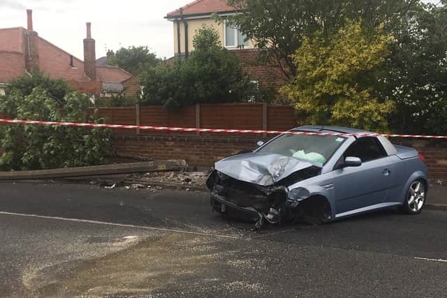 The Vauxhall Tigra crashed into the lamppost and the tree