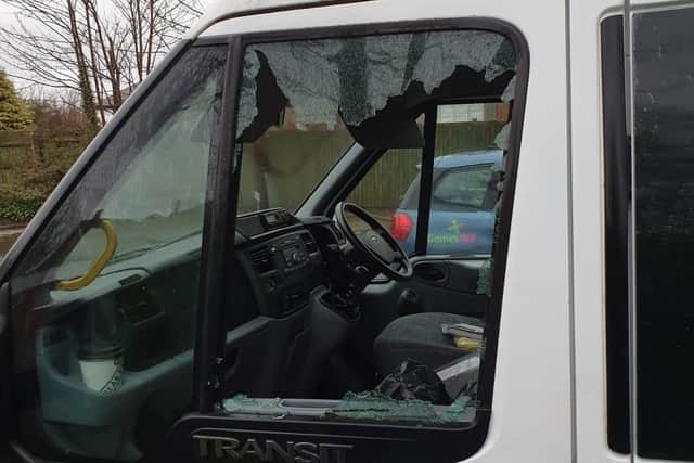 The smashed window of Blackpool Carers' minibus Molly, which put it off the road at a crucial time for the charity