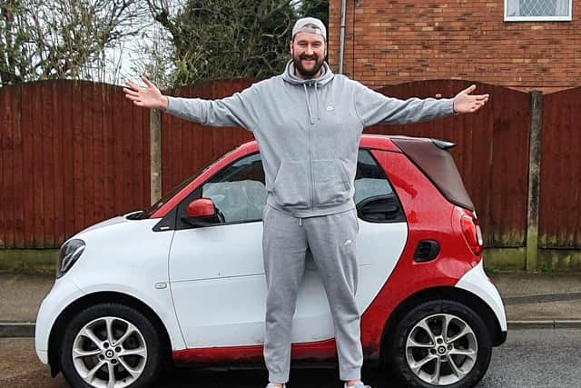 Despite his 7ft1in size, the 32-year-old drives a tiny Smart car