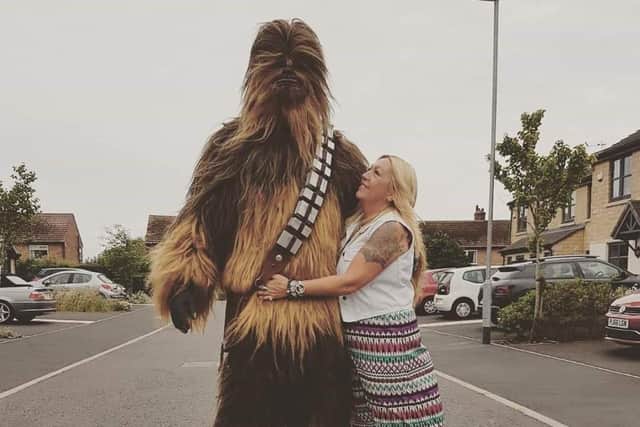 Lydon wearing his Chewbacca outfit, standing with his mum