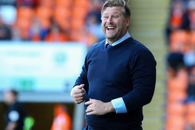 Karl Robinson considers the speculation to be over after Oxford turned down Blackpool's approach
