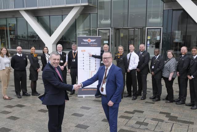 CounMark Smith and Garry Clark of Grand Central celebrate the lease of the new train crew hub with Grand Centrals first batch of new recruits