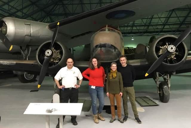 From left, Eric Watkiss (Saving Amy ) Jenny Lockyer (entertainer) Jane Priston (Amy Johnson Project) Dallas Campbell (TV Presenter) examining the RAF Museum Hendons Airspeed Oxford