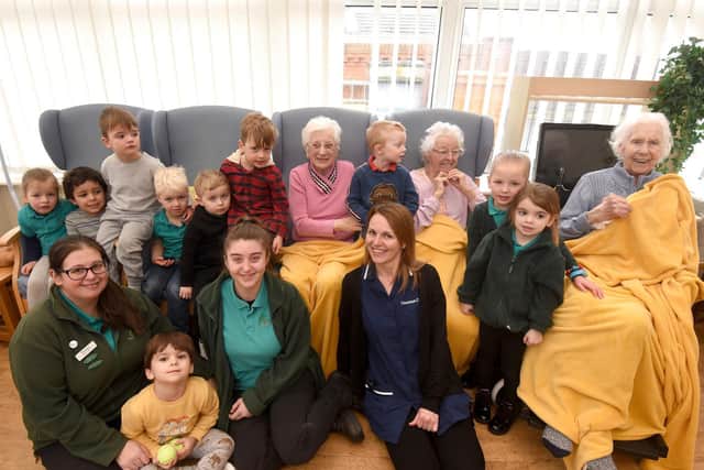 Children from Little Explorers Carleton and Little Explorers Thornton meet the residents of Westport House Care Home.