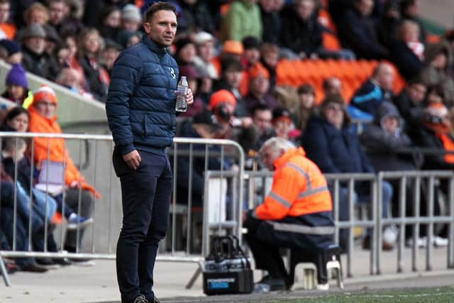 Former Kidderminster Harries boss John Eustace pictured on the touchline at Bloomfield Road in 2016 during an FA Cup game against the Seasiders