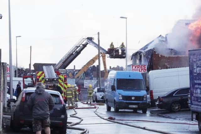Fire crews tackle the fire at a tyre fitters in Cowley Road, off Vicarage Lane in Marton