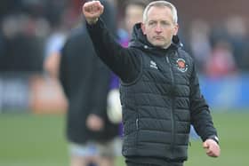 Neil Critchley salutes the Blackpool fans after the final whistle