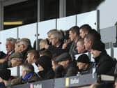 Joey Barton (back row, third from right) will be back in the dugout at Portsmouth tonight after completing his touchline ban on Saturday