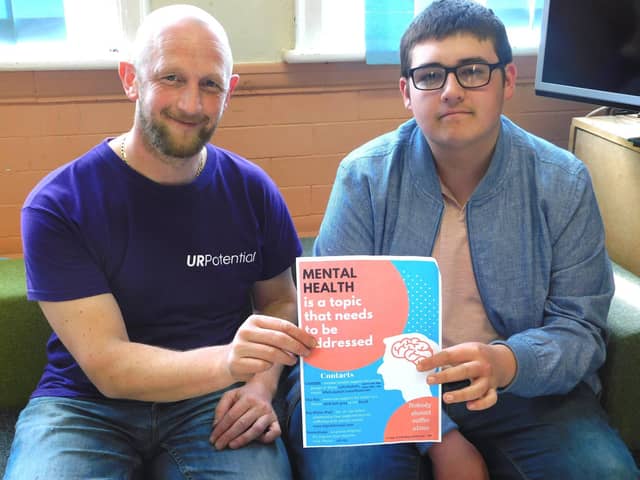 Chris Smith and Simon Crabtree with the mental health poster designed by young people in Wyre (pictured in 2018)