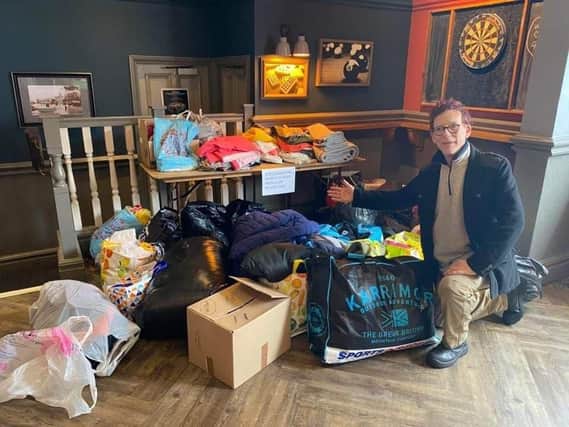 Andy Ostin at the Lord Derby with some of the items donated so far