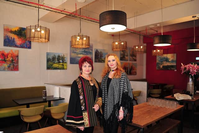 Anna Ravliuc and Irina Rojin with their Honeycomb Metamorphosis Art Exhibition on display at the Hive Coffee shop in Blackpool