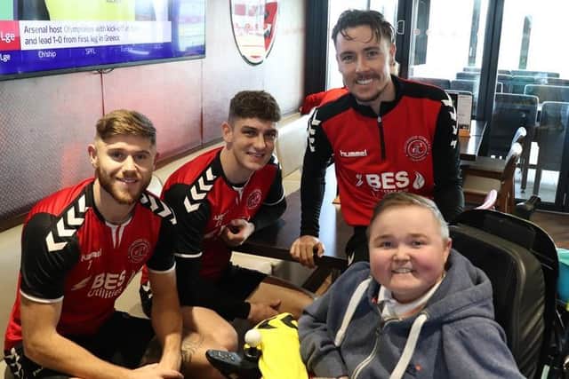 Jack with Fleetwood Town FC players Wes Burns, Harrison Biggins and Barrie McKay