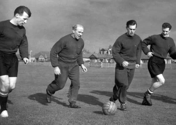 Manchester United manager Matt Busby (second from left) joins in training in Blackpool with (l-r) team captain Roger Byrne, Colin Webster and Bill Whelan    Picture: PA Images/PA Wire