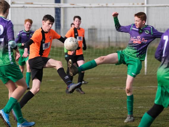 Hogan Cup action between Poulton Town Under-15s and St Annes Diamonds two days before grassroots football was shut down
