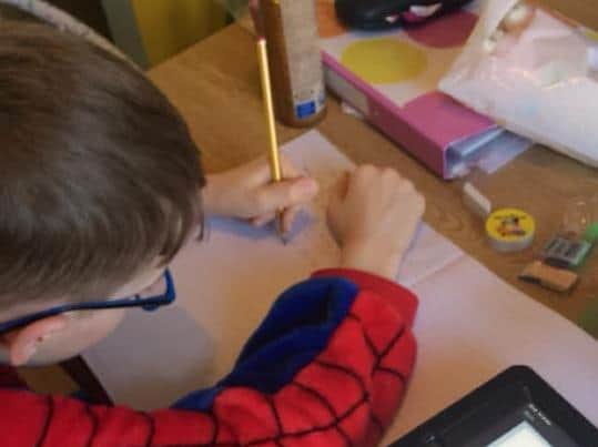 Eight-year-old Jacob used his tablet to take part in school work from his Bispham home.