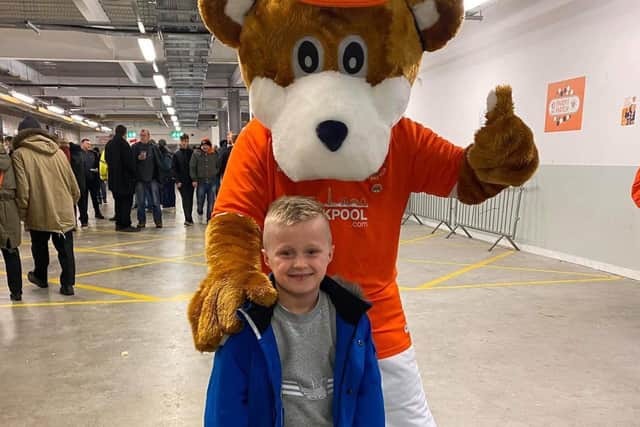 Luca, 8, got to take on Blackpool star Marc Bola in a game of FIFA 20