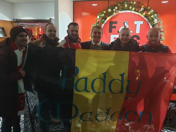 The Belgian fans who visited Fleetwood Town were greeted by chairman Andy Pilley (centre) and their hero Paddy Madden (far right)