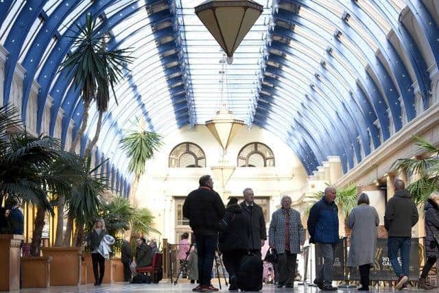 Visitors inside the Floral Hall at the Winter Gardens