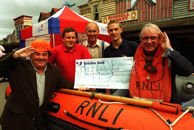Little and Large hand over a cheque for 1,100, to RNLI crew member David Warburton, at Blackpool Pleasure Beach.