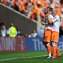 Charlie Adam and former Blackpool teammate Stephen Crainey