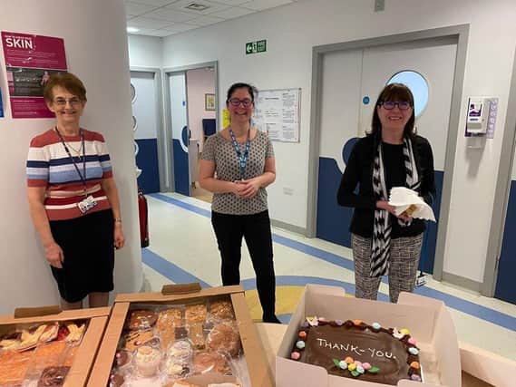 Clifton Hospital secretaries Ros Tillbrook, Sheryl Ormand and Lynne Reynolds with cakes donated to the hospital by Pam and Mike Young
