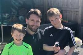 Dobbie pictured with his sons Maxwell and Jack...before having their heads shaved