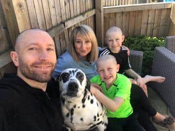 Dobbie pictured with wife Susanne and the two boys
