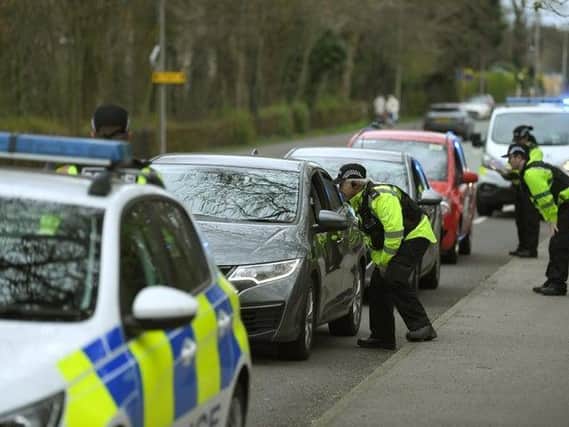 A police roadblock in Garstang Road, Preston, as officers enforce the lockdown rules