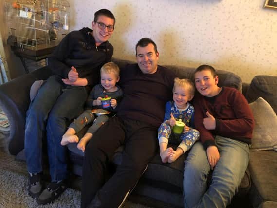 Stephen Betteridge back at home with children from left: Nathan 14, Declan, 12, and twins, Logan and Kieran, both four