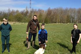 Taking a break from their desks,,, Aspire pupils with Roe the Springer Spaniel helps bring outdoor learning to life.
