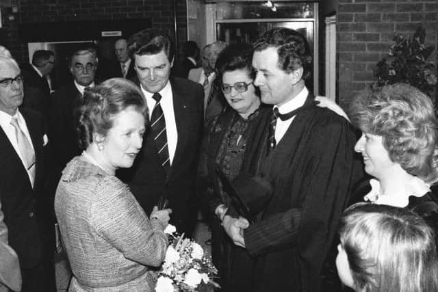 Sir Walter Clegg in the background, to the left, during a visit to Arnold School by Margaret Thatcher