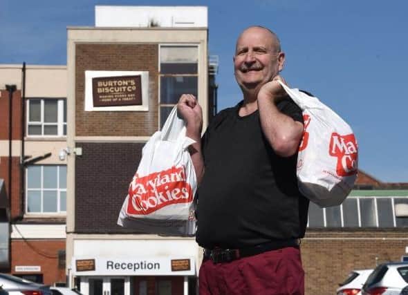 Bernie Glen of Burton's Biscuits in Blackpool, with bags of Maryland Cookies for neighbours