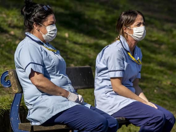 Stock image of carers wearing PPE