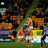 Supporters watch Blackpool in action against Tranmere Rovers six weeks ago - the last match at Bloomfield Road before the shutdown