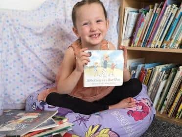 Six year-old Eva Jean Mawdsley hopes her YouTube channel and Facebook page will enable her to read to the whole of England during the coronavirus lockdown. Photo: Karen Feather