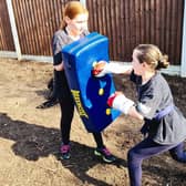 Two of Lee's students taking part in home classes.