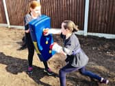 Two of Lee's students taking part in home classes.