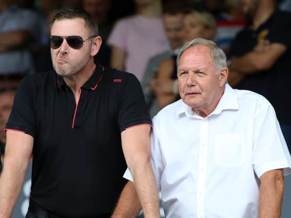 Peterborough chairman Darragh MacAnthony (left) with director of football Barry Fry at their opening game of the season against Fleetwood Town