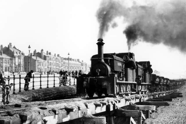 A temporary steam railway on the seafront in 1911 to help with construction.