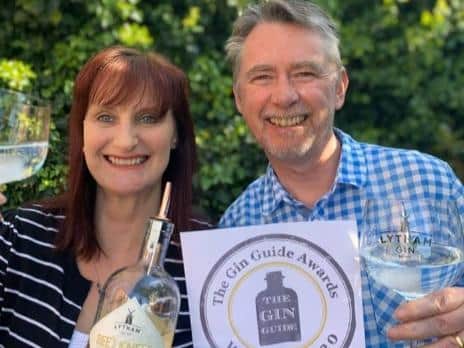 Sara and Paul Dewhurst with their award for Sandgrown Spirits' Bees Knees gin