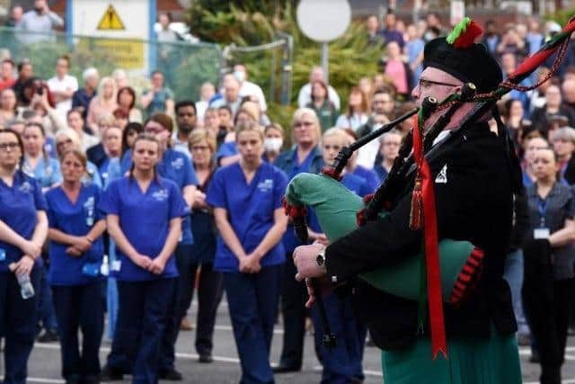 Emotional scenes outside Wigan Infirmary where staff and public mourn the loss of four Wigan health workers who contracted Covid-19