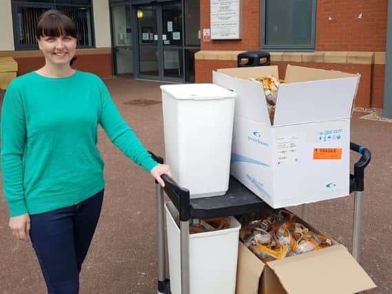 Liz Hill, a science technician at Lytham St Annes High School, with goggles donated to the NHS by the school from its science department