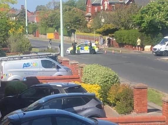 Bispham Road was closed for nearly an hour after a crash involving a police car and a BMW