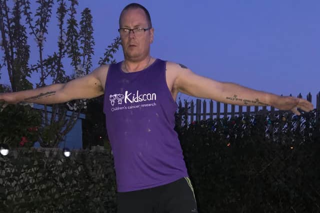 Kelvin in lockdown training in the garden for the London Marathon in aid of Kidscan