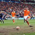 Charlie Adam strokes home Blackpool's second goal from the penalty spot