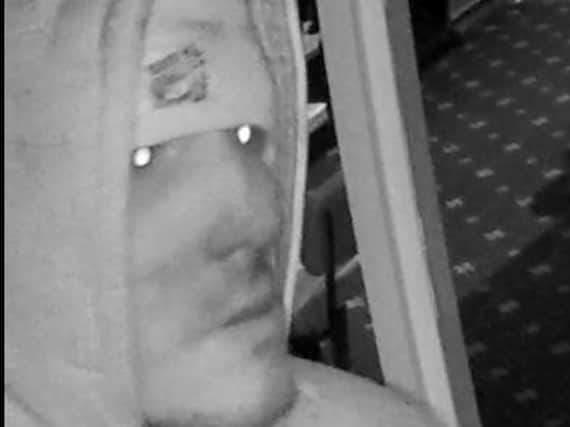 Police want to speak to this man in connection with a burglary at Warwicks Amusements in Waterloo Road on February 27. Pic: Lancashire Police