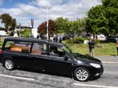 The funeral cortege of Keith Shuck passes through Staining as people line the streets
