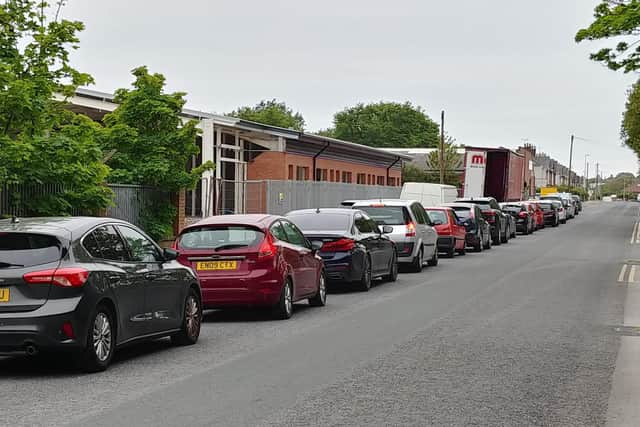 Cars queue on Bristol Avenue waiting to get in the tip