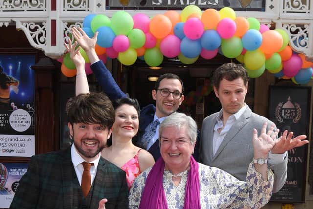 CEO of Grand Theatre Ruth Eastwood with the cast of Around the World in 80s Days ahead of the 2019 summer production.