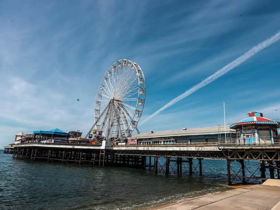 Blackpool's Central Pier, with its prominent Big Wheel, and the beach below, are quiet and empty, as the town's tourist industry hopes lockdown will soon end and the crowds return.